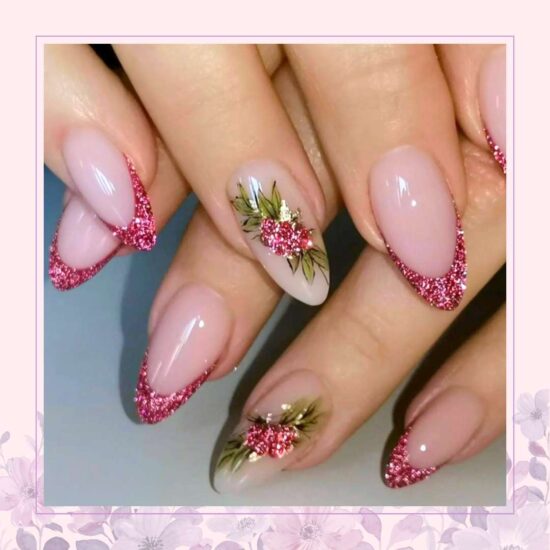 Nude base nail design with pink glitter French tips and berries