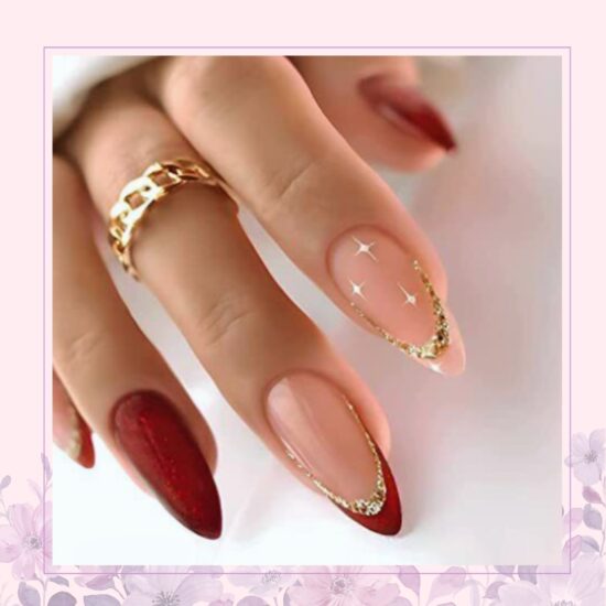 deep red and nude nail design with gold accent